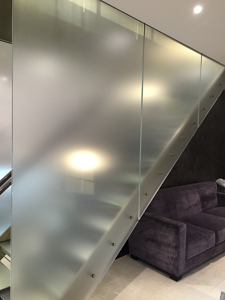 Commercial window film on glass stairwell